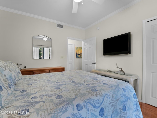 4306 Serena Cir, Saint Augustine, FL 32084 - bedroom with crown molding, wood finished floors, ceiling fan, and visible vents
