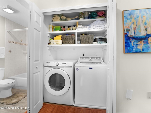 4306 Serena Cir, Saint Augustine, FL 32084 - washroom with separate washer and dryer, laundry area, and wood finished floors