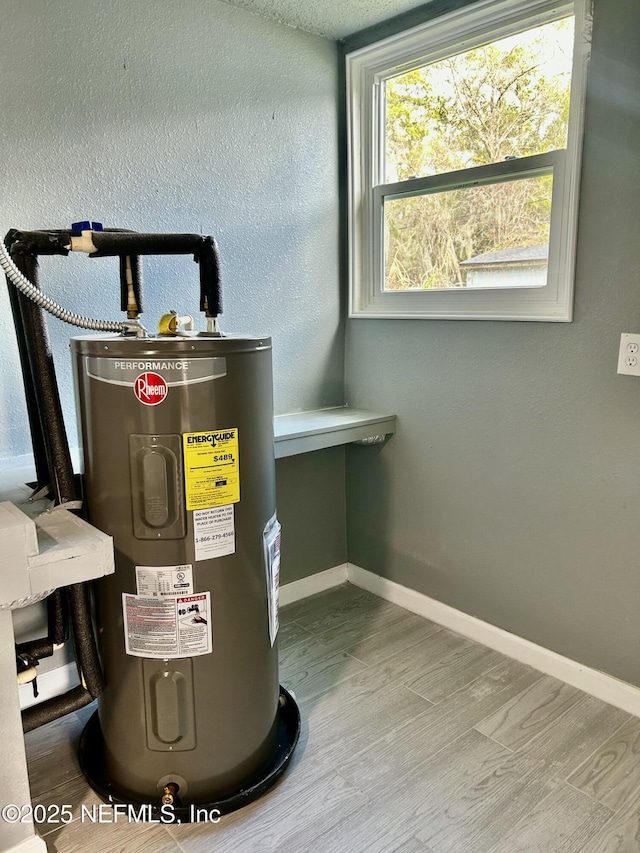 utility room with electric water heater