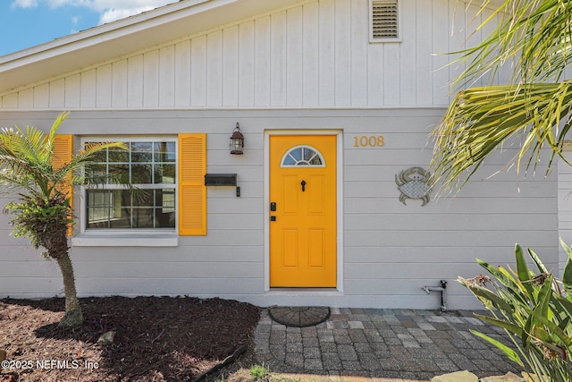 property entrance with visible vents