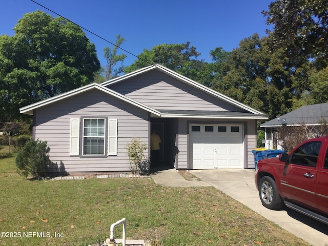 single story home featuring a front yard, concrete driveway, and an attached garage