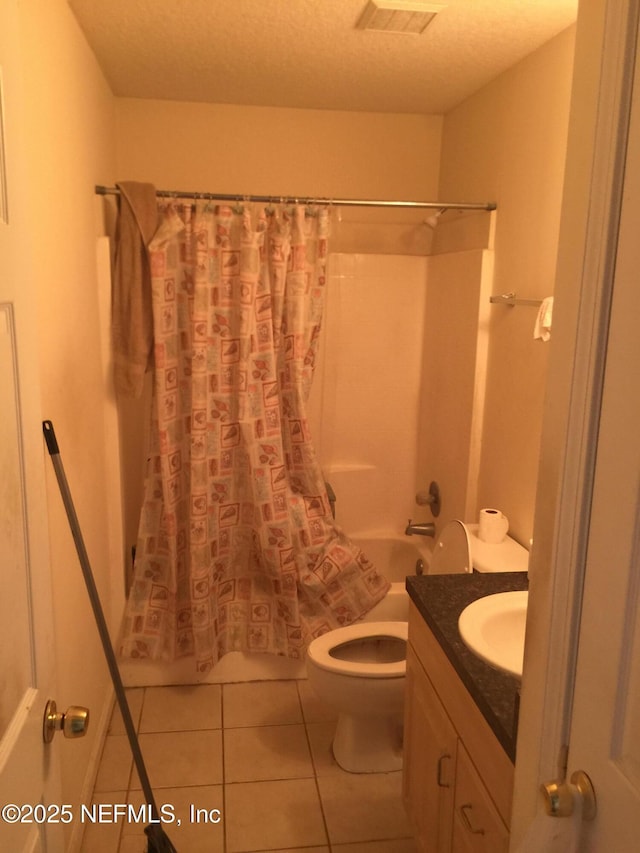 full bath with visible vents, toilet, tile patterned floors, shower / bath combination with curtain, and vanity