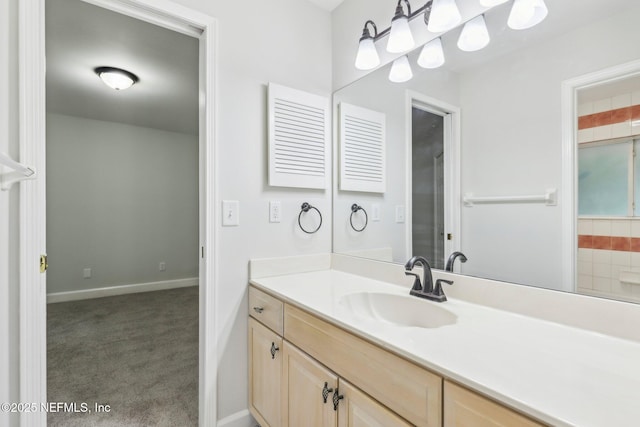 bathroom with baseboards and vanity