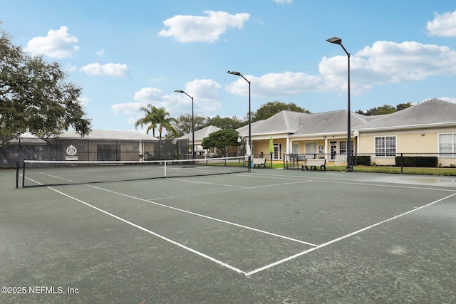 view of sport court with fence