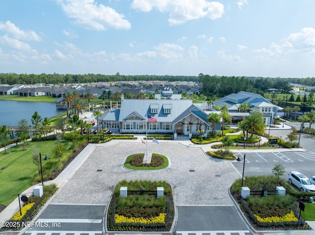 birds eye view of property featuring a water view and a residential view