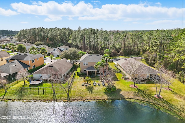 drone / aerial view featuring a water view and a residential view
