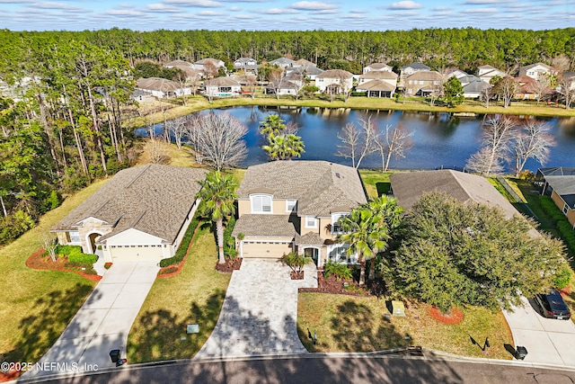 birds eye view of property featuring a water view and a residential view