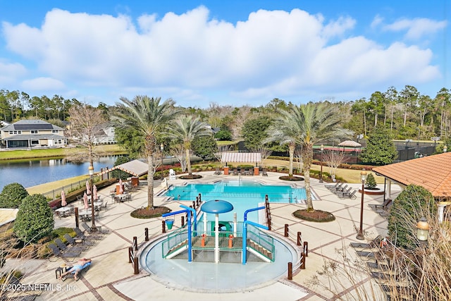 view of swimming pool featuring a water view and a patio