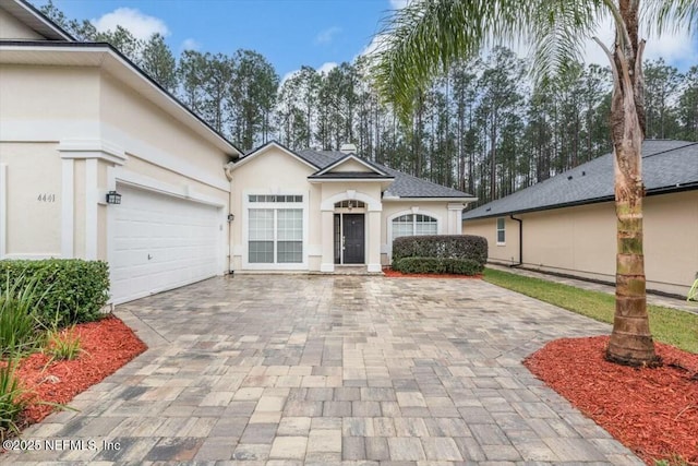 ranch-style house featuring a garage