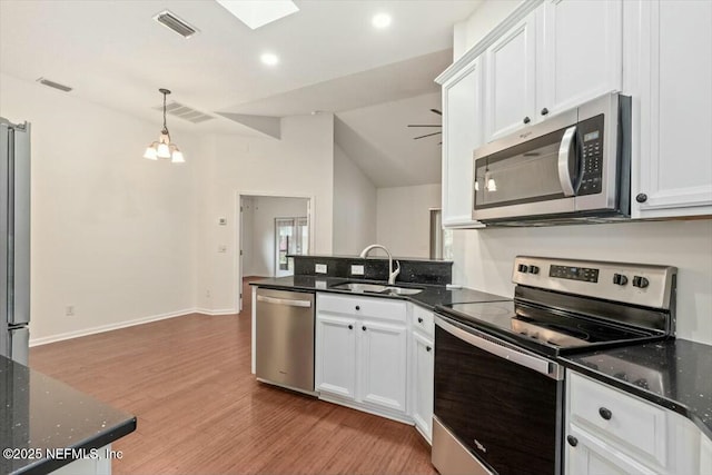 kitchen featuring white cabinetry, appliances with stainless steel finishes, and sink