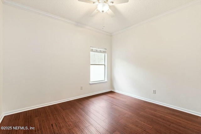 empty room featuring dark hardwood / wood-style flooring, a textured ceiling, crown molding, and ceiling fan