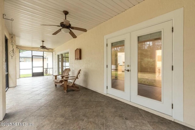 unfurnished sunroom featuring french doors