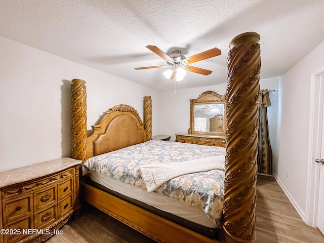 bedroom with a textured ceiling and ceiling fan