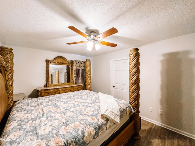 bedroom with dark hardwood / wood-style flooring, a textured ceiling, and ceiling fan