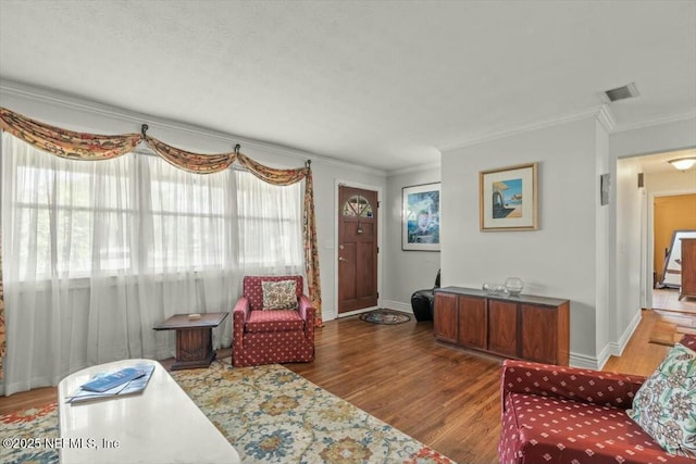 living room with ornamental molding and dark wood-type flooring