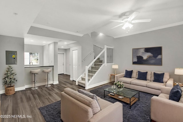 9745 Touchton Rd Unit 127, Jacksonville, FL 32246 - living room featuring electric panel, wood finished floors, crown molding, baseboards, and stairway