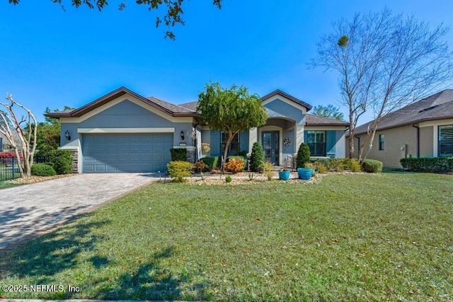 view of front facade featuring decorative driveway, stucco siding, a garage, stone siding, and a front lawn