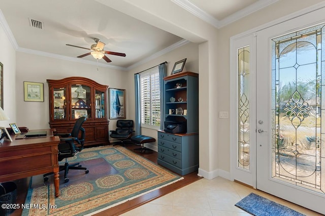 foyer featuring ornamental molding, tile patterned flooring, visible vents, and baseboards