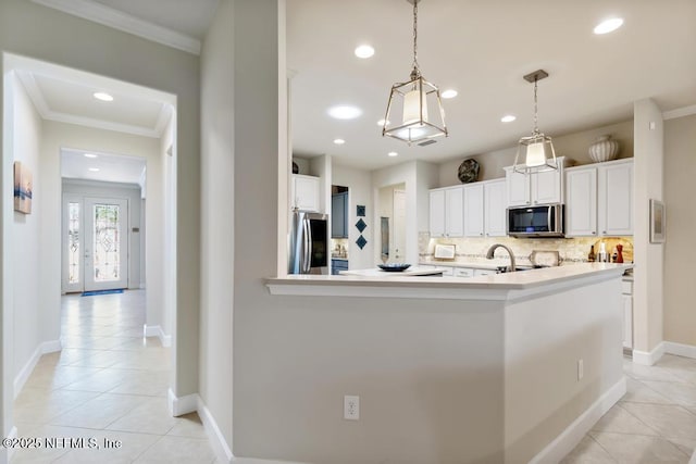 kitchen with stainless steel appliances, ornamental molding, decorative backsplash, and light tile patterned floors