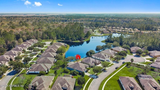 aerial view with a water view, a forest view, and a residential view