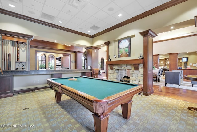 playroom with crown molding, pool table, a fireplace, and ornate columns