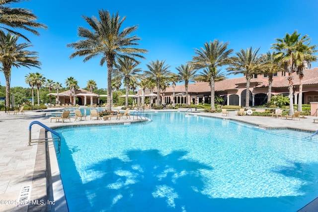 community pool featuring a patio area