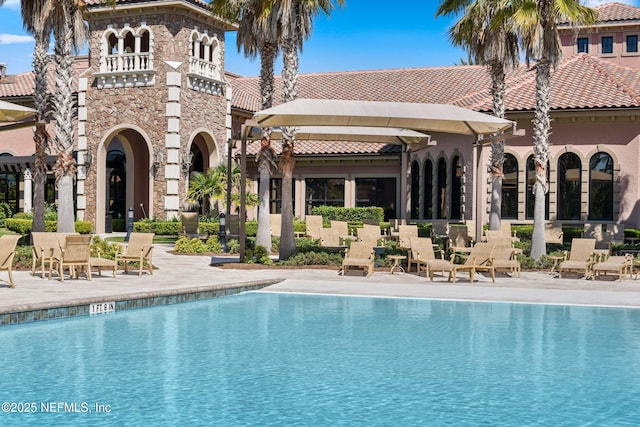 pool featuring a patio area