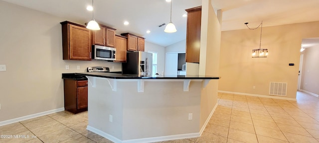 kitchen with dark countertops, visible vents, appliances with stainless steel finishes, light tile patterned flooring, and brown cabinetry