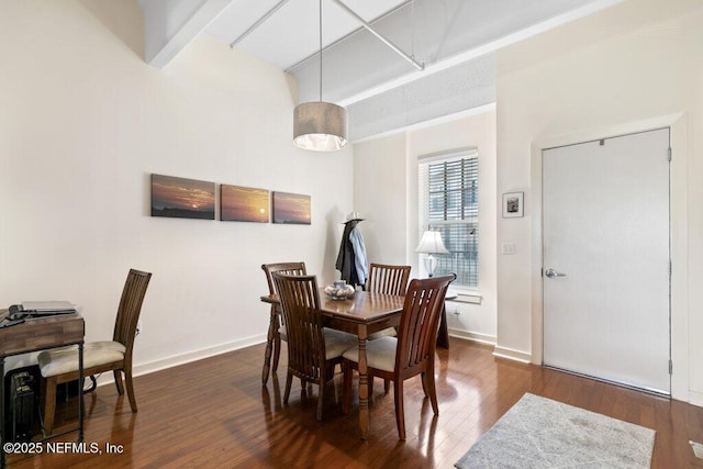 dining area featuring dark hardwood / wood-style flooring