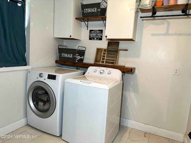 laundry area featuring cabinets and separate washer and dryer