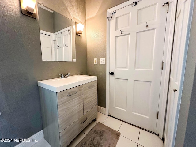 bathroom featuring vanity and tile patterned flooring