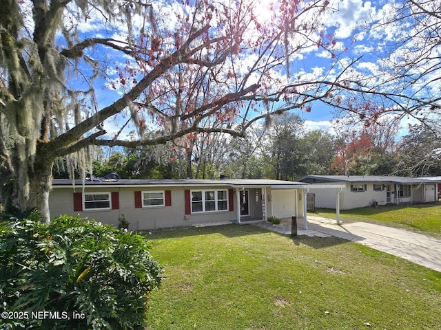 single story home with a garage and a front lawn