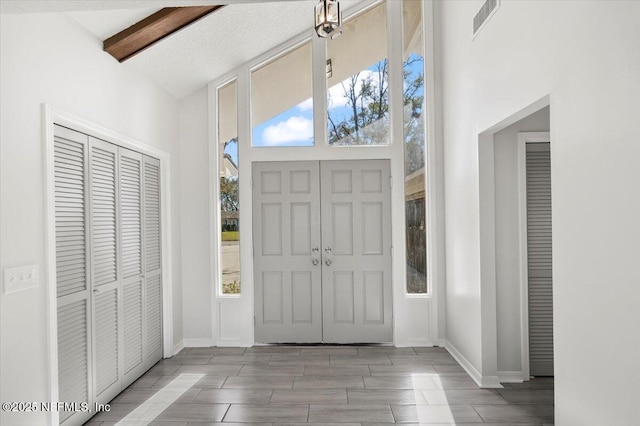 foyer entrance featuring a high ceiling