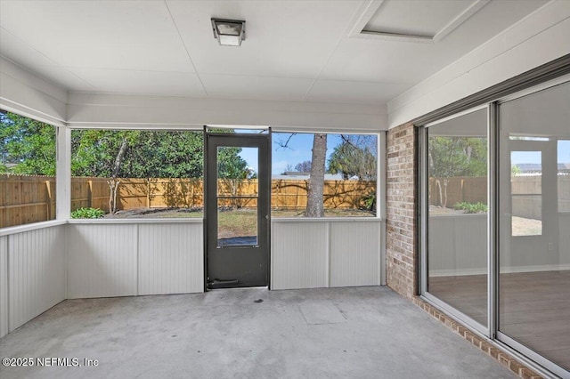 unfurnished sunroom featuring plenty of natural light