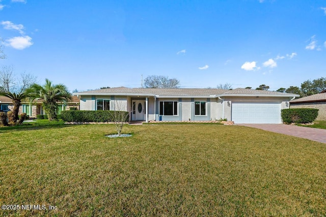 ranch-style home with a front yard and a garage