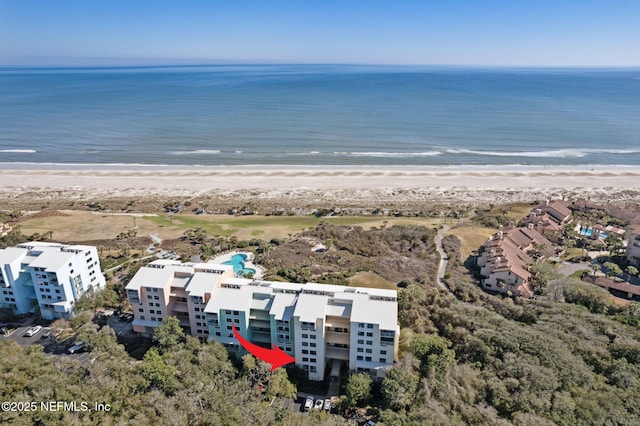 bird's eye view with a water view and a view of the beach