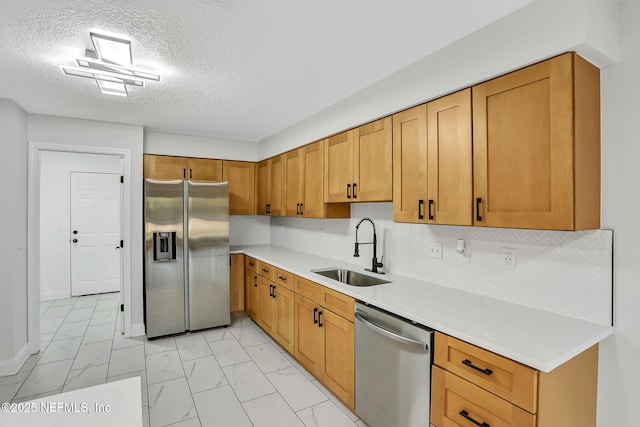 994 Lakeridge Dr, Orange Park, FL 32065 - kitchen with a sink, marble finish floor, light countertops, appliances with stainless steel finishes, and backsplash