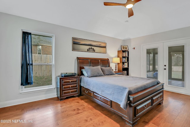 994 Lakeridge Dr, Orange Park, FL 32065 - bedroom with multiple windows, baseboards, wood finished floors, and french doors