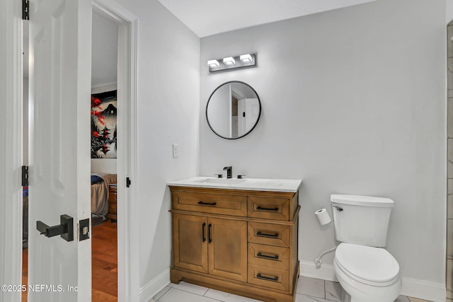 994 Lakeridge Dr, Orange Park, FL 32065 - ensuite bathroom with vanity, ensuite bath, toilet, and baseboards