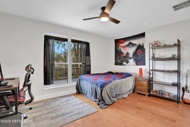994 Lakeridge Dr, Orange Park, FL 32065 - bedroom with baseboards, ceiling fan, visible vents, and wood finished floors