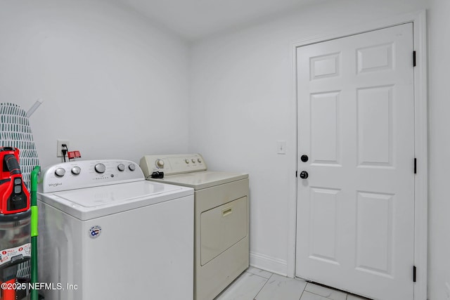 994 Lakeridge Dr, Orange Park, FL 32065 - laundry area featuring laundry area, marble finish floor, baseboards, and separate washer and dryer