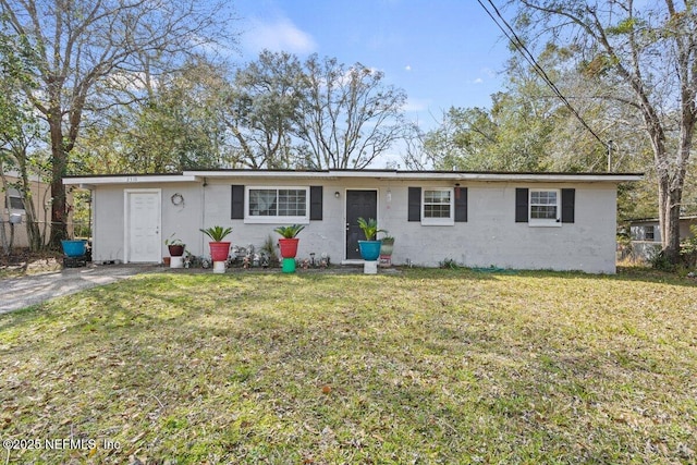 ranch-style house with a front yard and fence