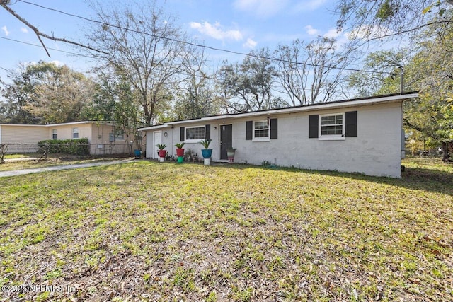 single story home with fence and a front lawn