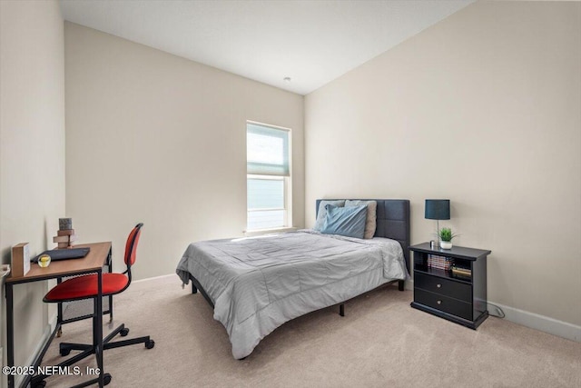 bedroom with carpet floors and baseboards