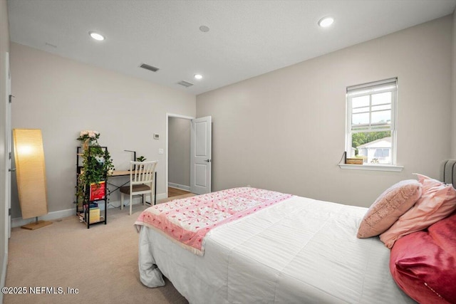 bedroom featuring baseboards, recessed lighting, visible vents, and light colored carpet