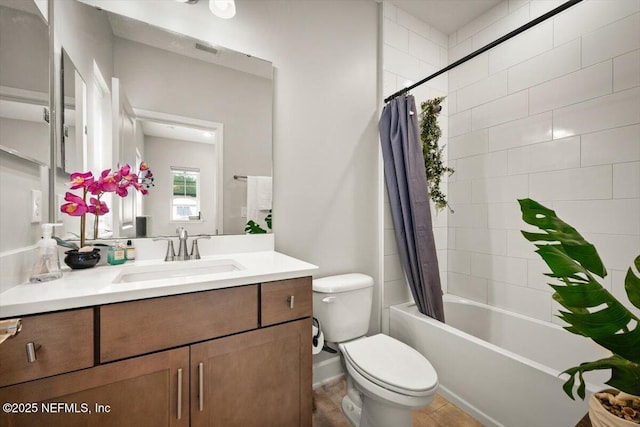 full bath featuring toilet, shower / bath combo, visible vents, and vanity