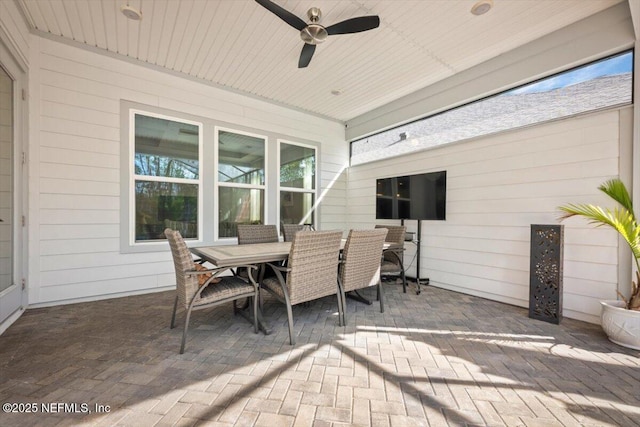 view of patio featuring a ceiling fan and outdoor dining space