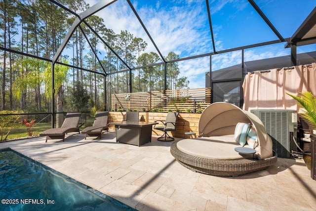 view of patio / terrace featuring glass enclosure, outdoor lounge area, and central air condition unit