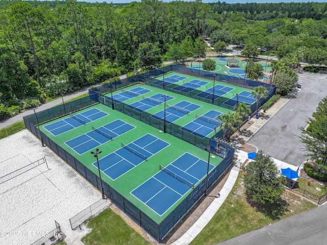 drone / aerial view featuring a view of trees