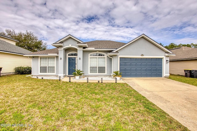 ranch-style home featuring a front yard and a garage